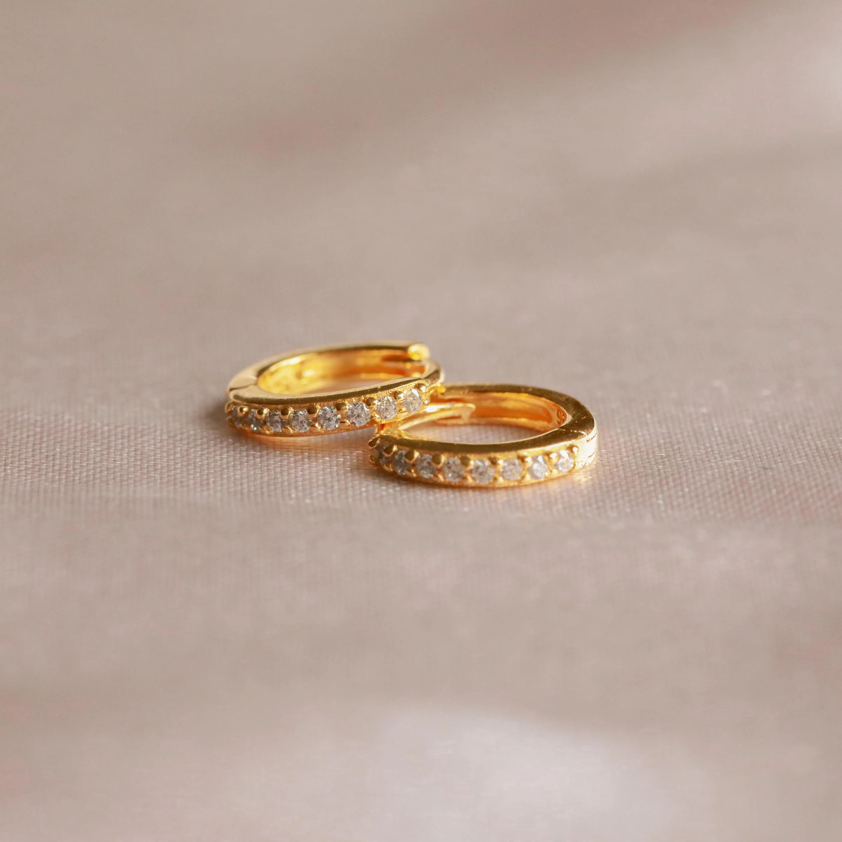 April Birthstone Huggies in Gold with White CZ - Image 3